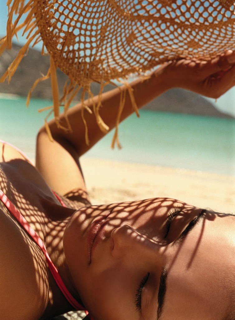 Woman Relaxing On Beach