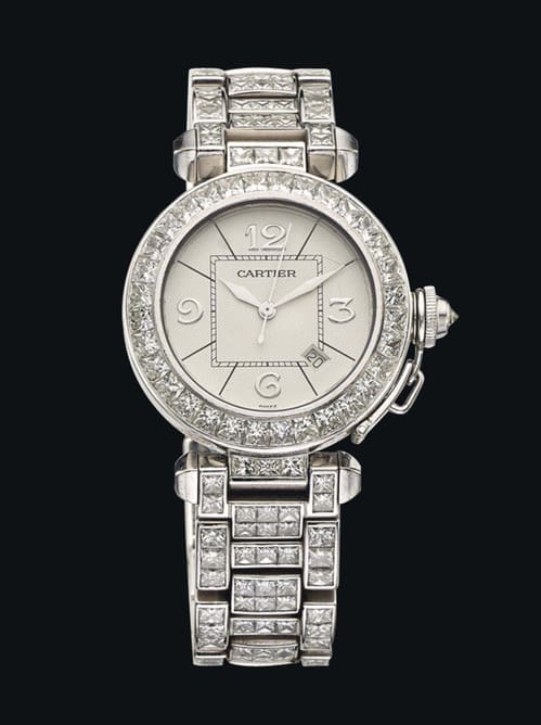Montre Pasha de Cartier, mouvement automatique, fonctions date et petite seconde. Pavage diamants. Estimation: 37 000 - 55 000 euros.